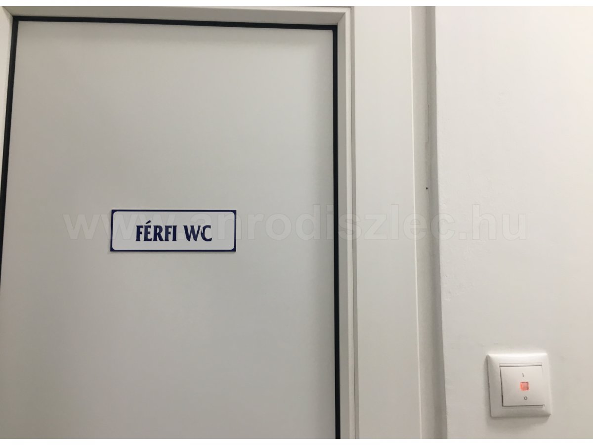 Valena világítós kapcsoló férfi mosdónál. Világít a visszajelző, a wc foglalt.